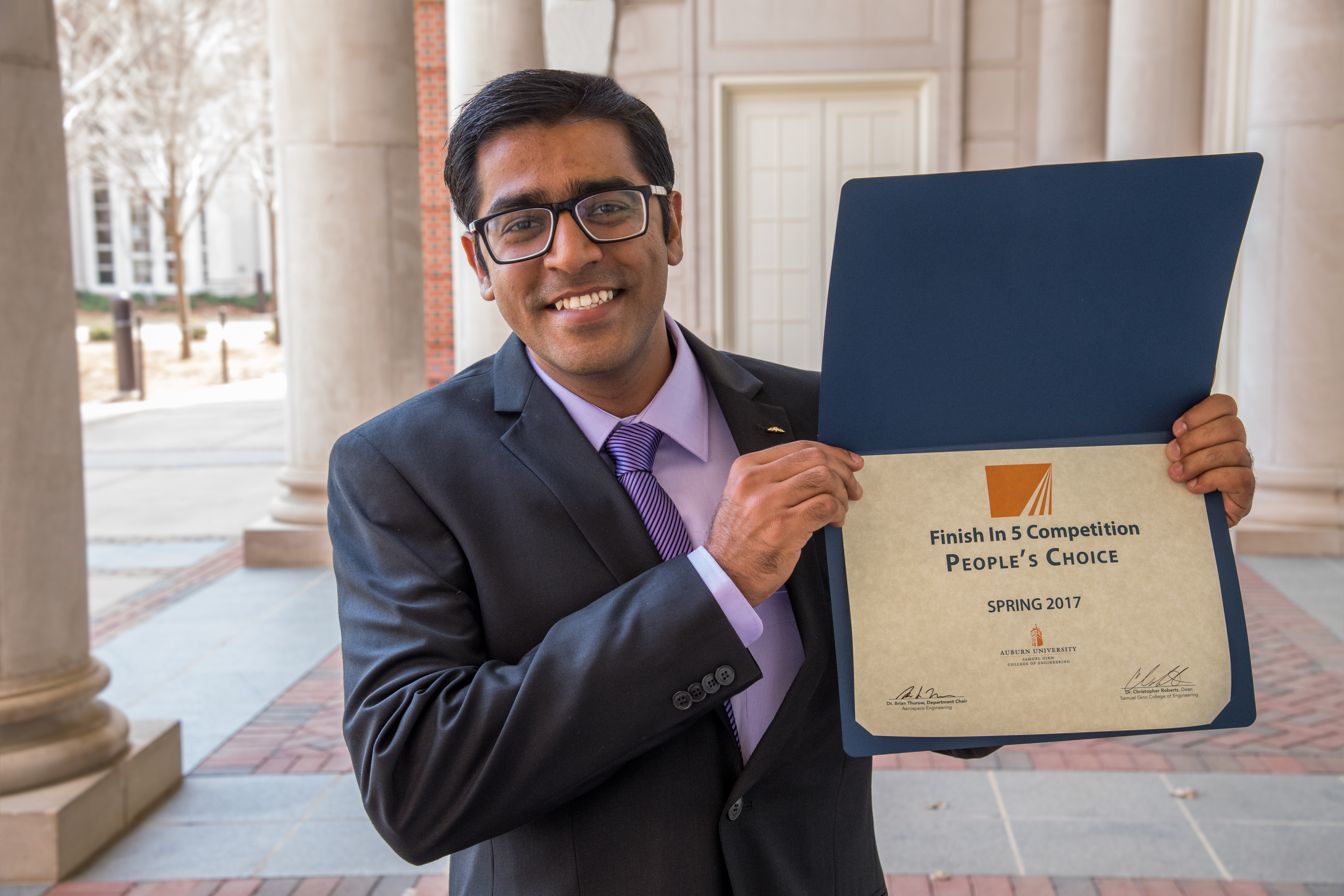Mehul Barde is shown with his award certificate.